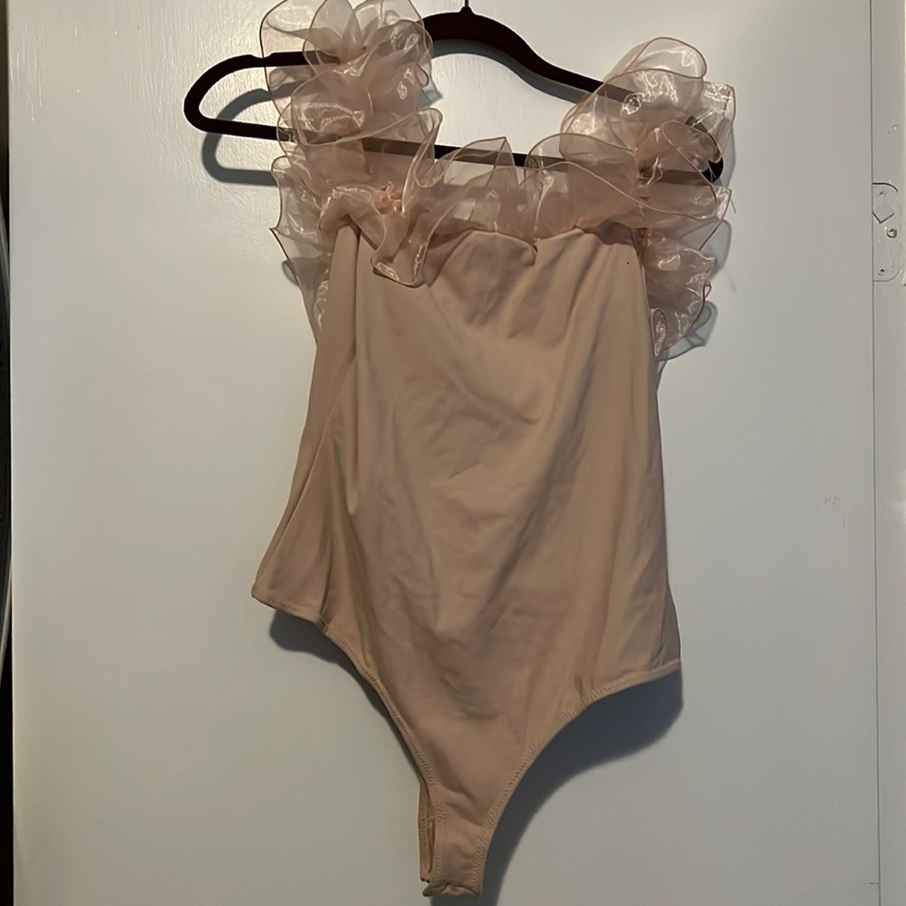 Free people XL pink ruffle body suit